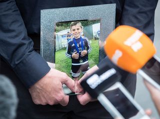 A picture of Stanley Metcalf held by his parents as they made their statement on Tuesday. Picture: PA