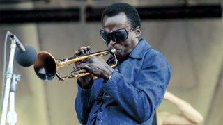 American trumpeter and composer Miles Davis (1926 - 1991) performing live on stage at the Newport Jazz Festival at Newport, Rhode Island, 5th July 1969. 
