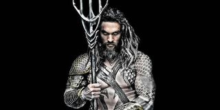 Jason Momoa as Aquaman holding trident