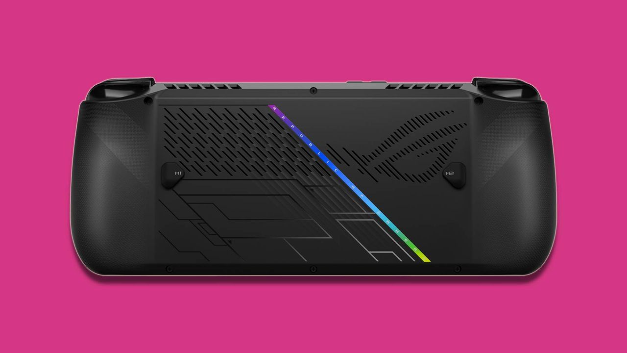 black PC gaming handheld against pink background