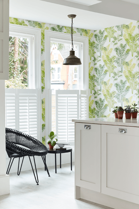 how to design an open plan kitchen: Tier on Tier Shutters in a kitchen with modern botanical wallpaper