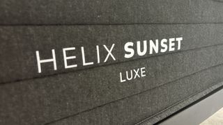 The foot of the Helix Sunset Luxe, displaying its logo.