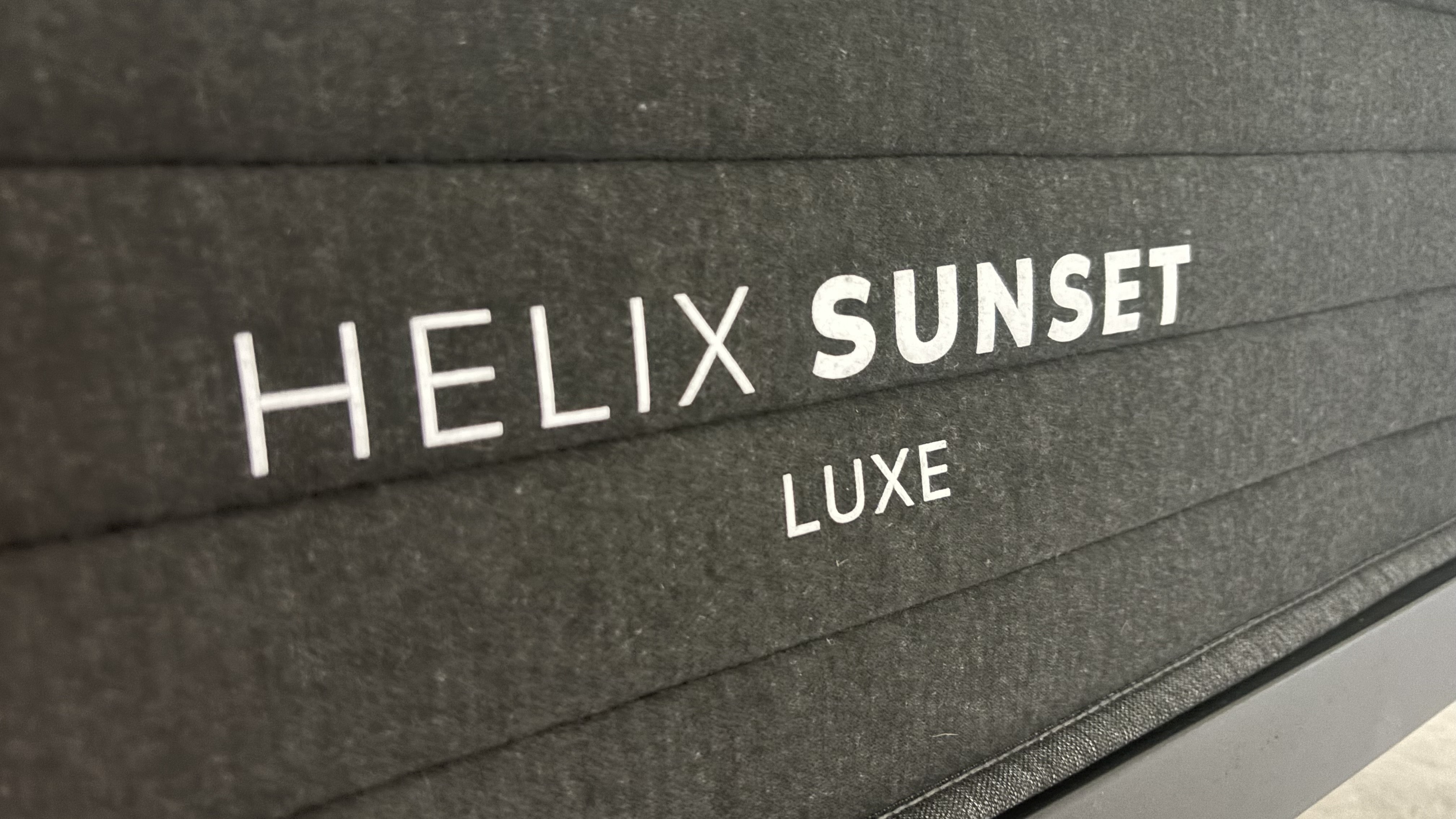 The foot of the Helix Sunset Luxe, displaying its logo. 