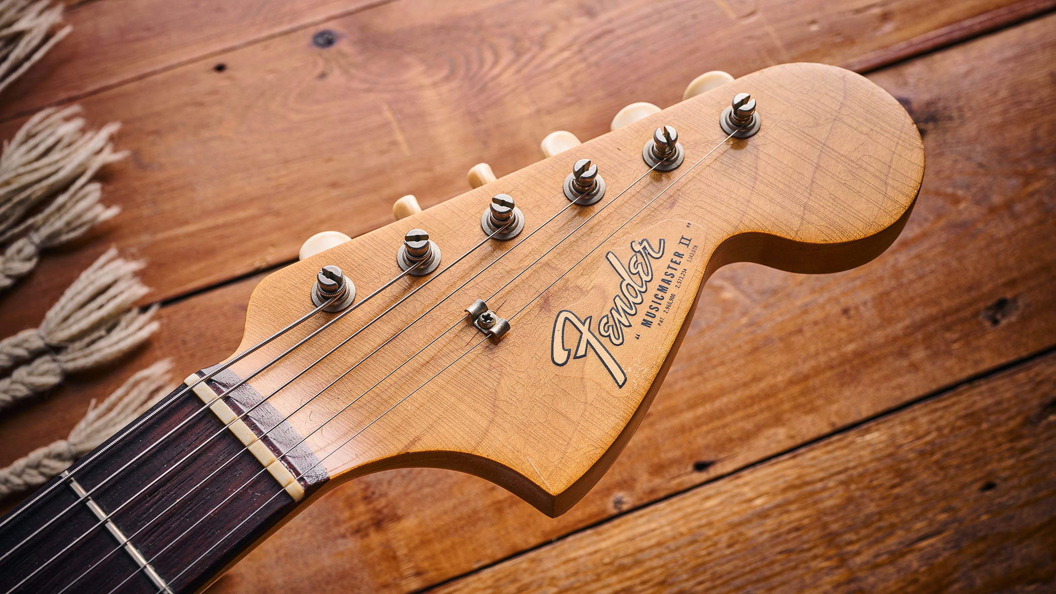 The headstock of a 1965 Fender Musicmaster II