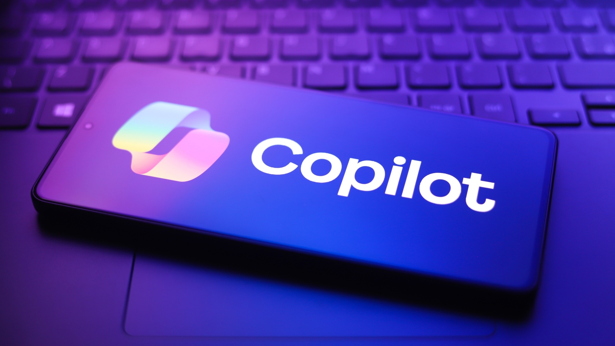 The Microsoft Copilot logo appears on a smartphone screen