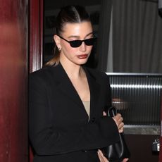 Hailey Bieber wears a black blazer