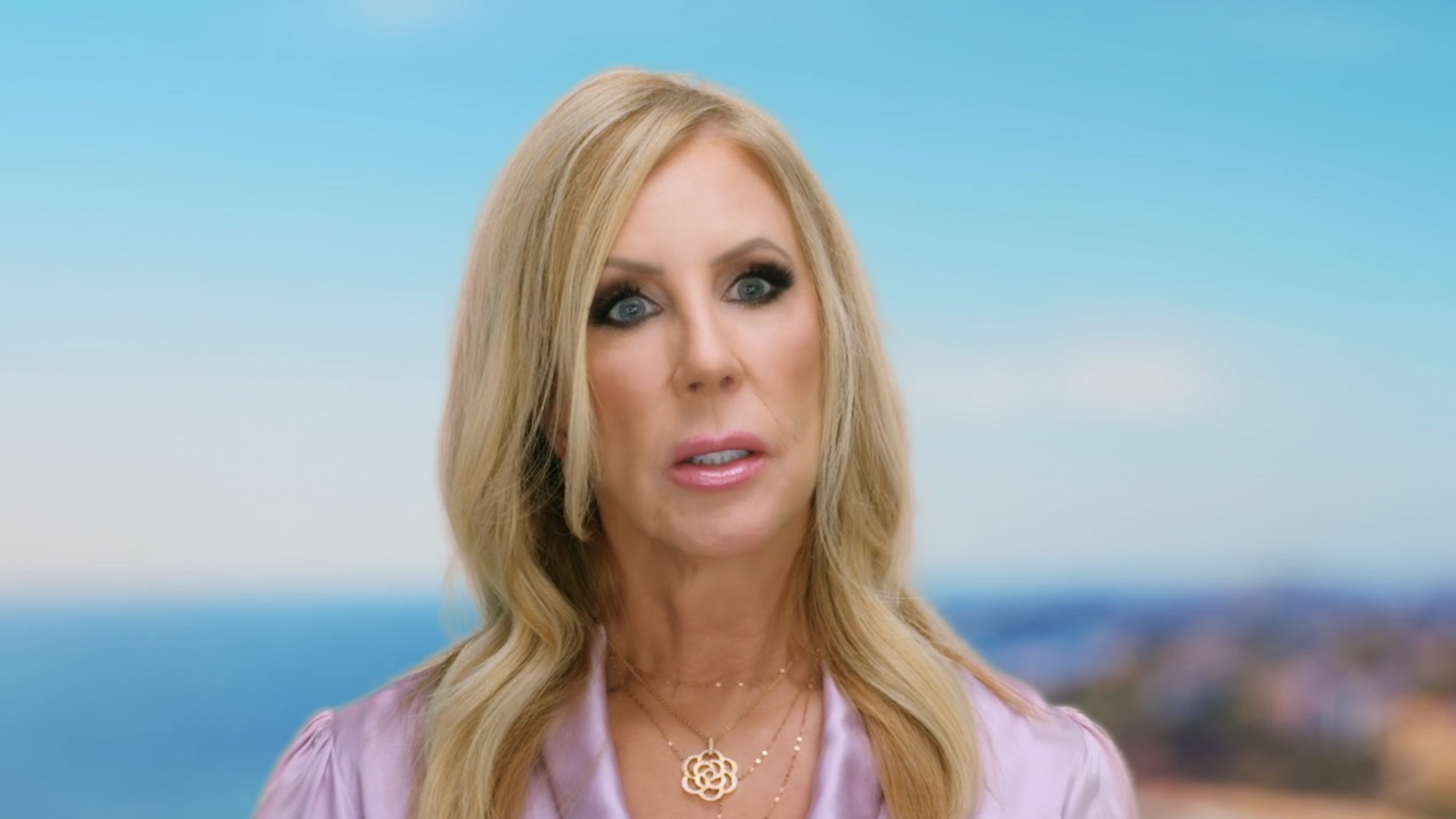 Vicki wearing purple in an Ultimate Girls Trip confessional.