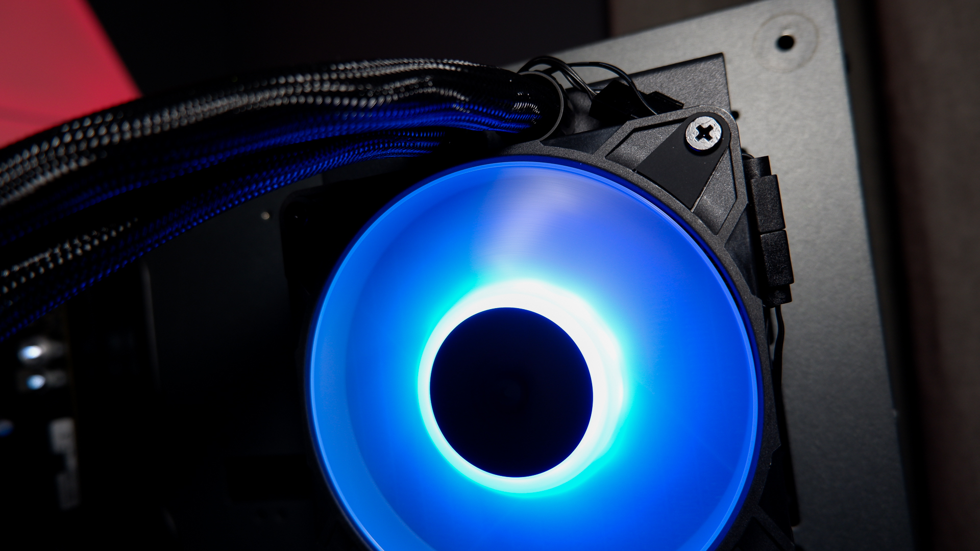 An Arctic Liquid Freezer III Pro liquid cooler set-up on a test bench with the RGB enabled.