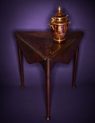 Rockefeller collection A Staffordshire porcelain fruit cooler atop a George II mahogany triangular drop-leaf table