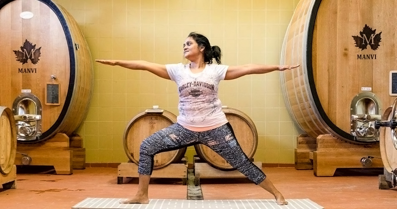 Manvi winery Sudha Manvi yoga pose in cellar