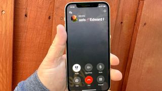 A phone call on an iphone 12, running iOS 18.1, with the call record feature available