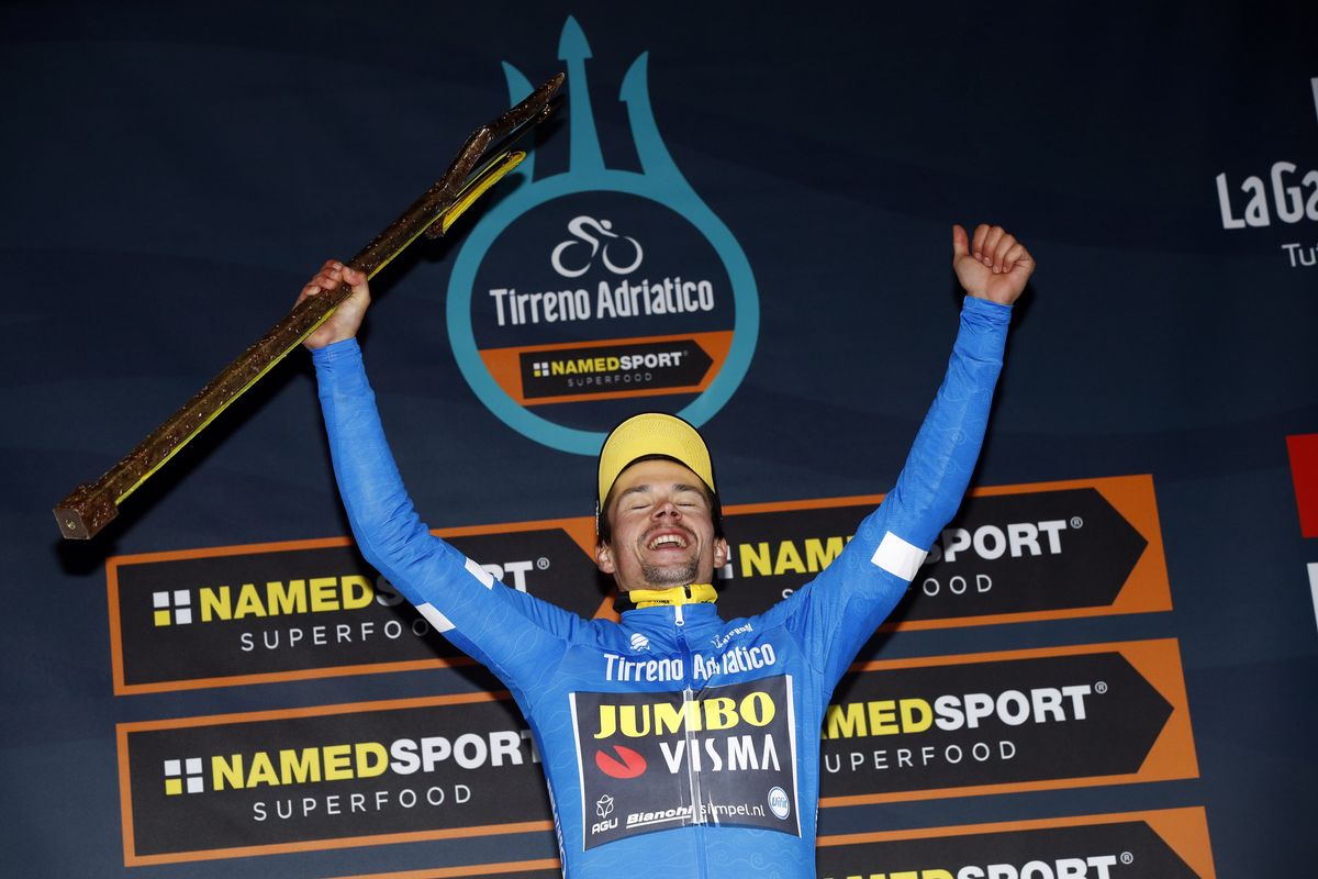 Primoz Roglic with the trident trophy