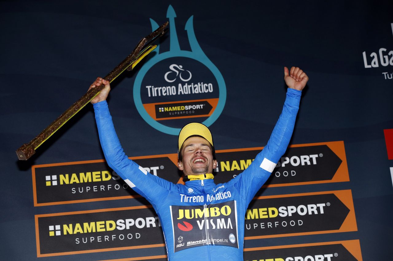 Primoz Roglic with the trident trophy