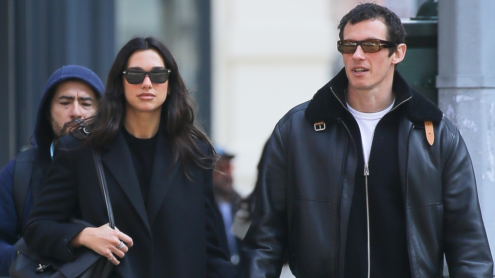 Dua Lipa livened up her all-black street style look with the Chanel maxi flap bag