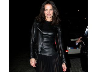 Katie Holmes wears a sexy leather dress at New York Fashion Week.