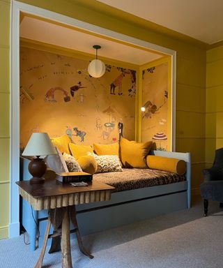 yellow wallpapered nook with task lighting for reading