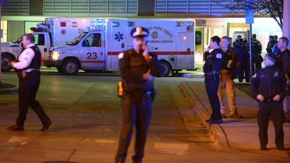 Police officers outside a Chicago hospital where injured officers are being treated.