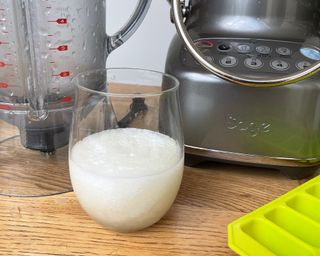 A frozen margarita made using the Sage 3X Bluicer appliance on wooden dining table