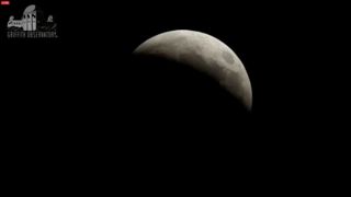 A sliver of the moon remains at about 7 am PT during the total lunar eclipse of April 4, 2015 in this view webcast from the Griffith Observatory in Los Angeles, California.
