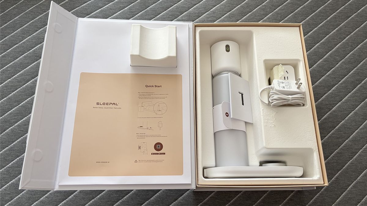 The Sleepal AI lamp in the box it was delivered in, including the cable and adapter.