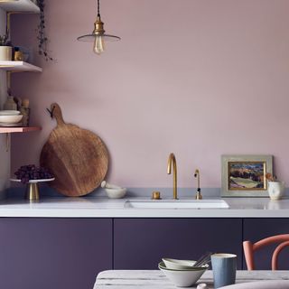 Pink kitchen with purple painted cabinetry