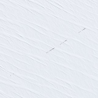 A French satellite captured this shot of a resupply convoy headed to Earth's remotest research station, Concordia in Antarctica. 
