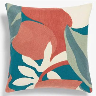 peach and green patterned cushion