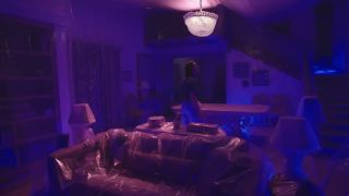 A room heavily covered in plastic and a purplish glow in Dexter: Original Sinin Dexter: Original Sin