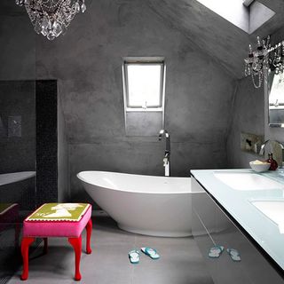 bathroom with grey wall bathtub grey flooring