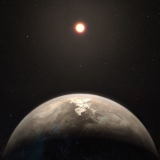 This artist’s illustration shows the temperate planet Ross 128b, with its red dwarf parent star in the background. The planet and star lie a mere 11 light-years from Earth.