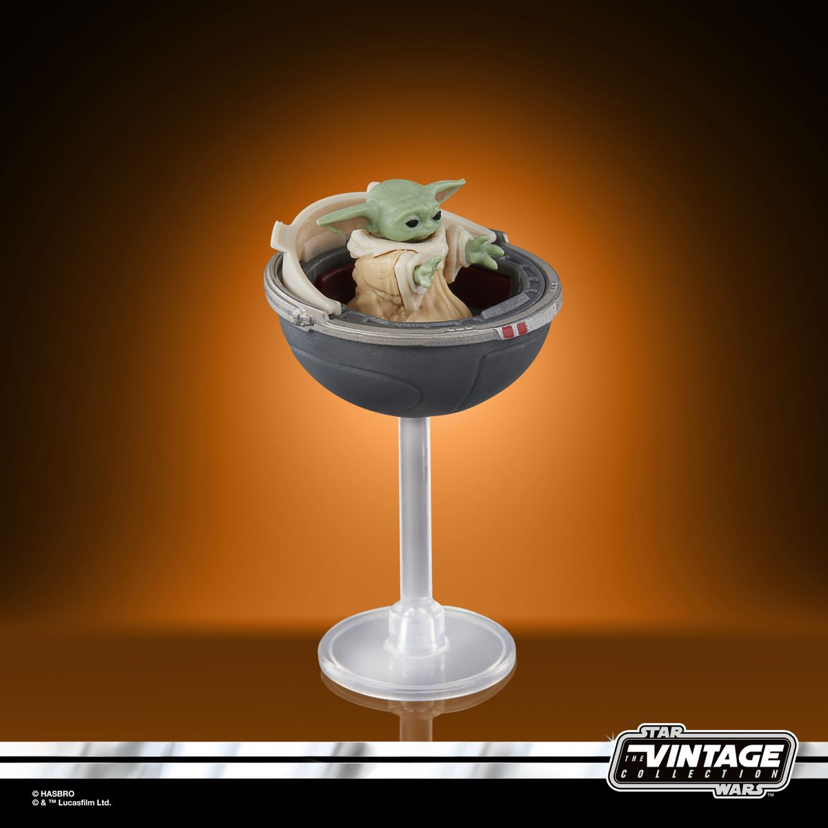 The Vintage Collection Grogu figure on an orange and black background