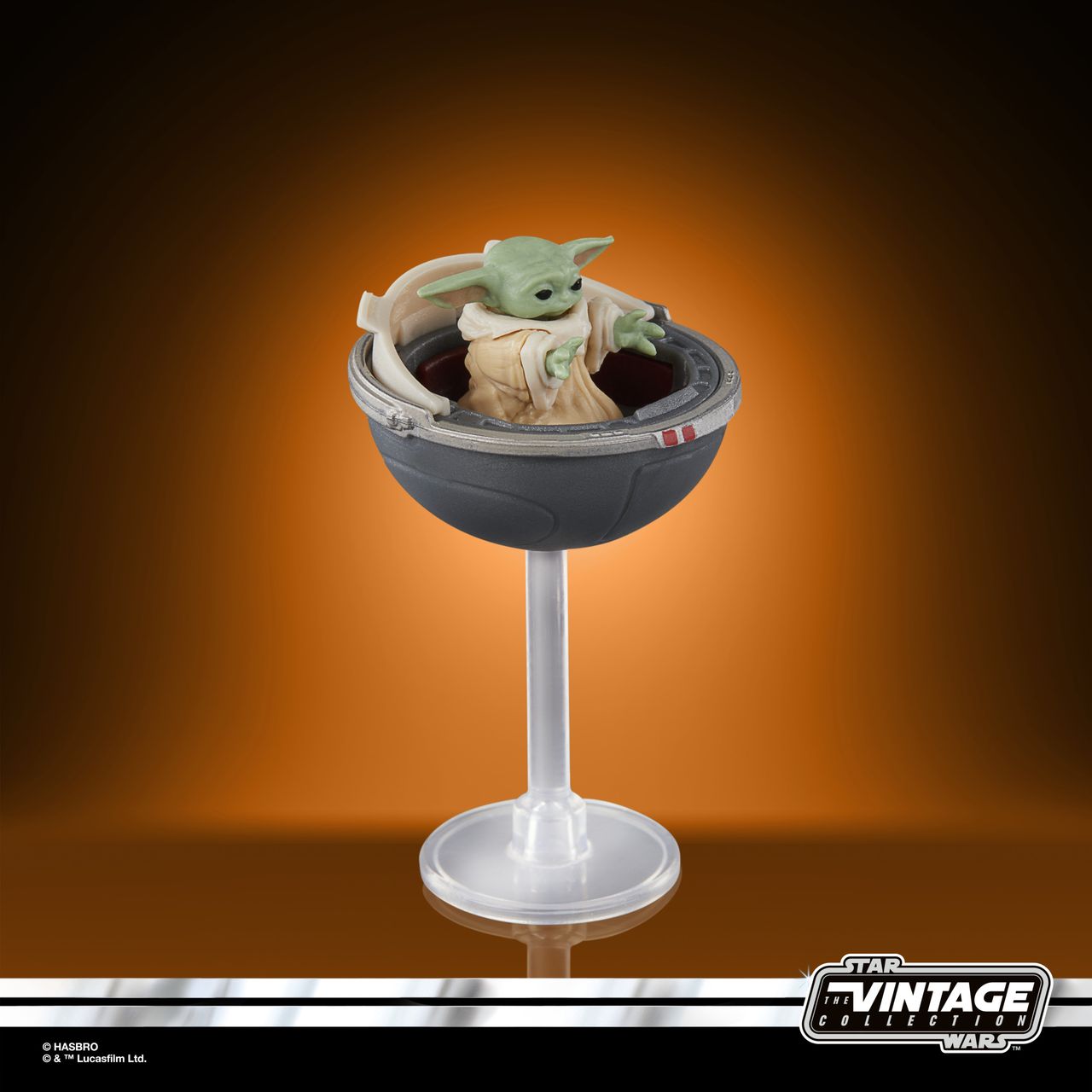 The Vintage Collection Grogu figure on an orange and black background