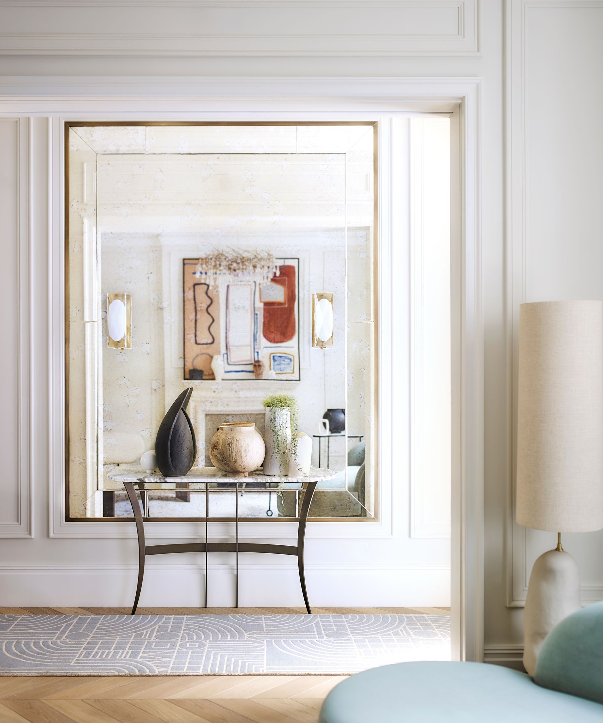 Living room with view to hallway with mirror and console table