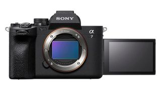 Sony A7 IV camera front view with lens detached, lens mount exposed and LCD screen flipped around