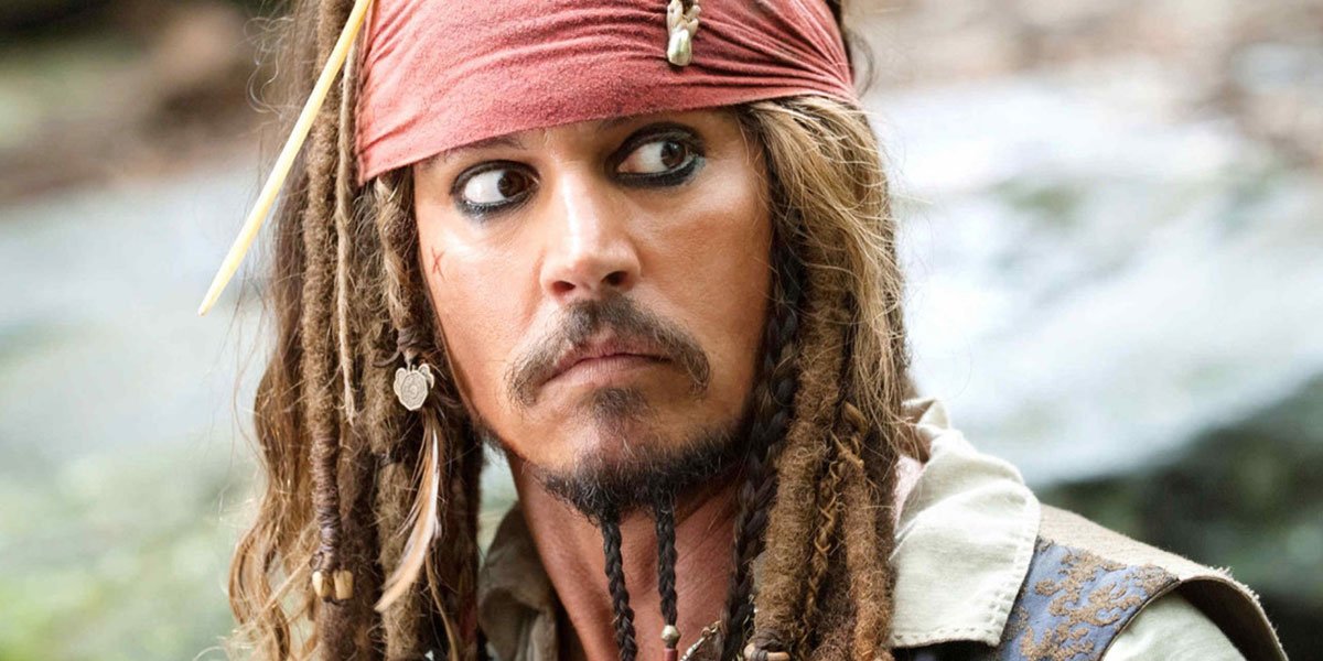 Johnny Depp with a red bandana on in Pirates Of The Caribbean glancing at something out of the corner of his eye.