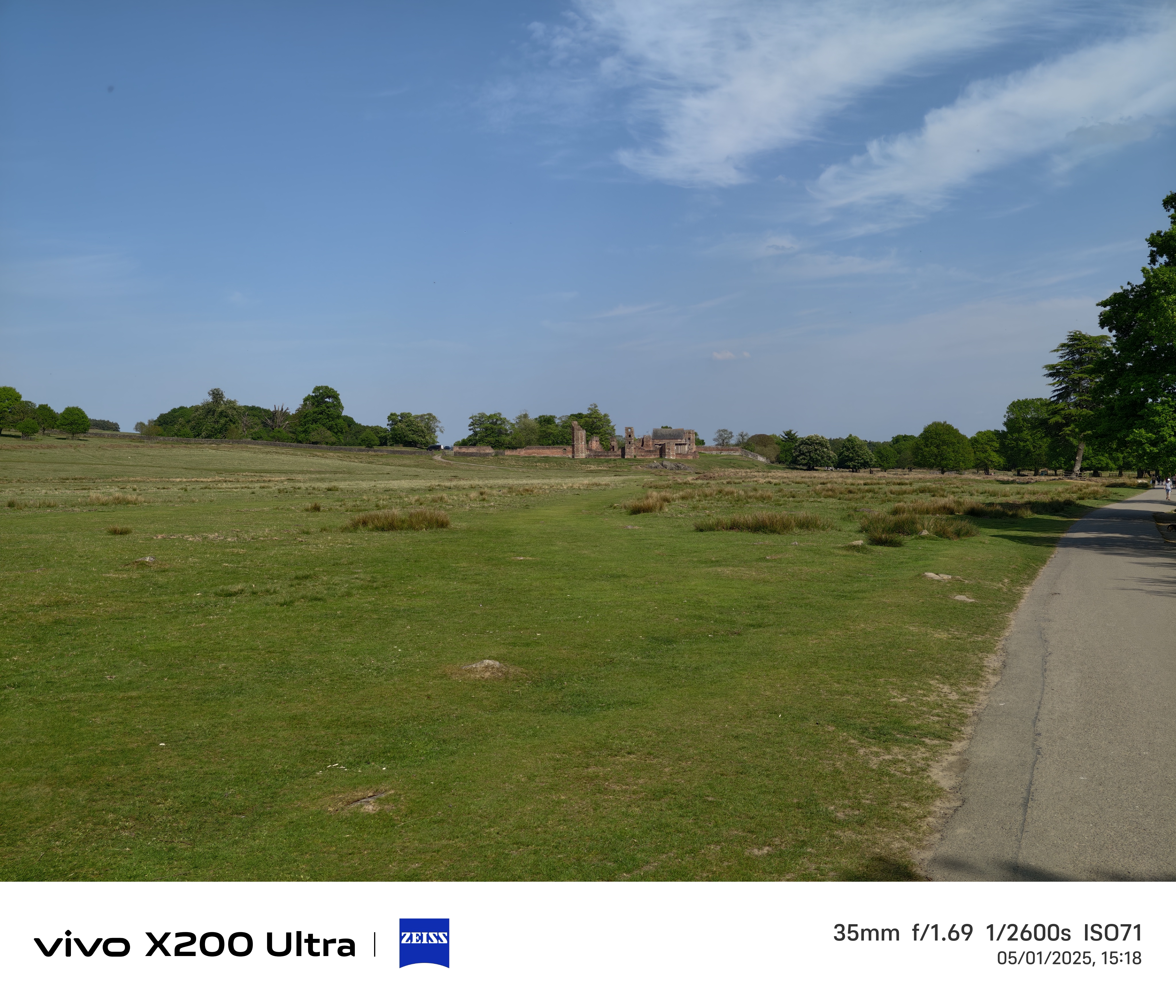 Old ruins in the distance across a field