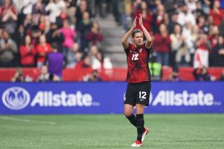 Christine Sinclair of Canada acknowledges fans as she leaves the field during the second half against Australia at BC Place on December 05, 2023 in Vancouver, British Columbia.