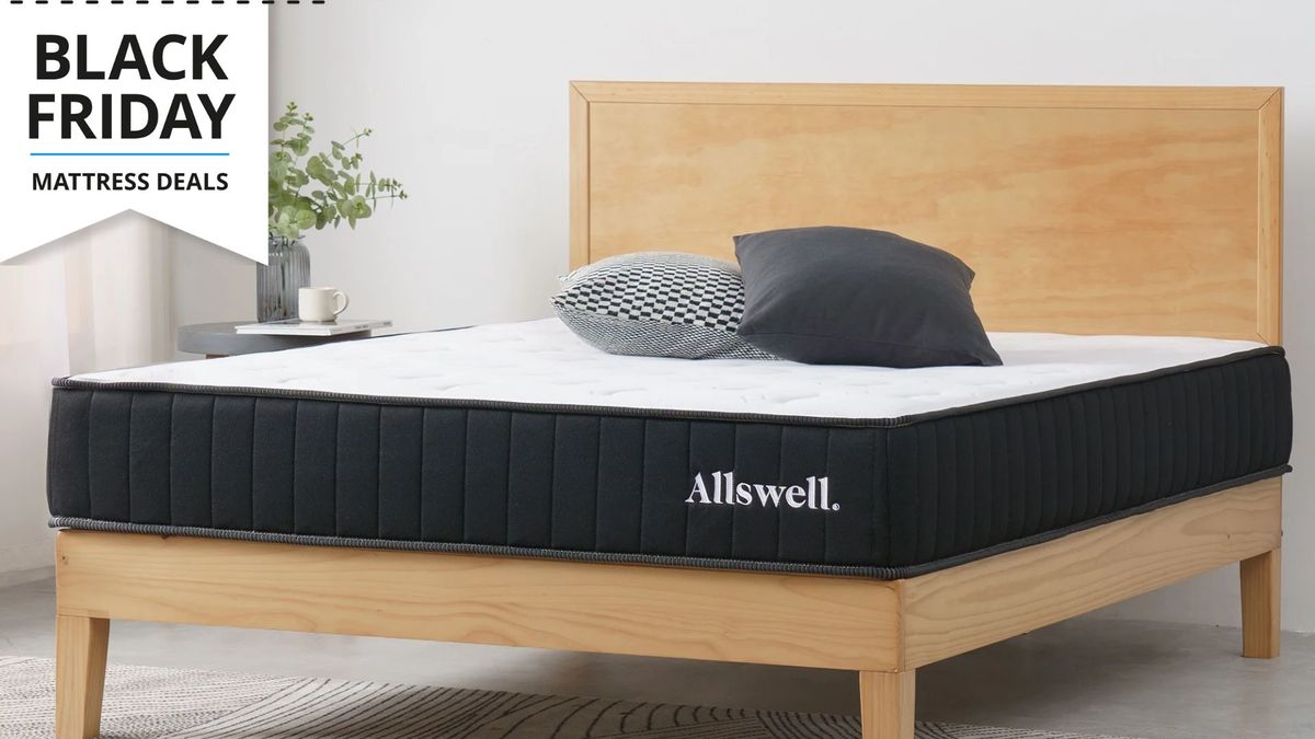 The Allswell hybrid mattress on a bed frame in a brightly lit room