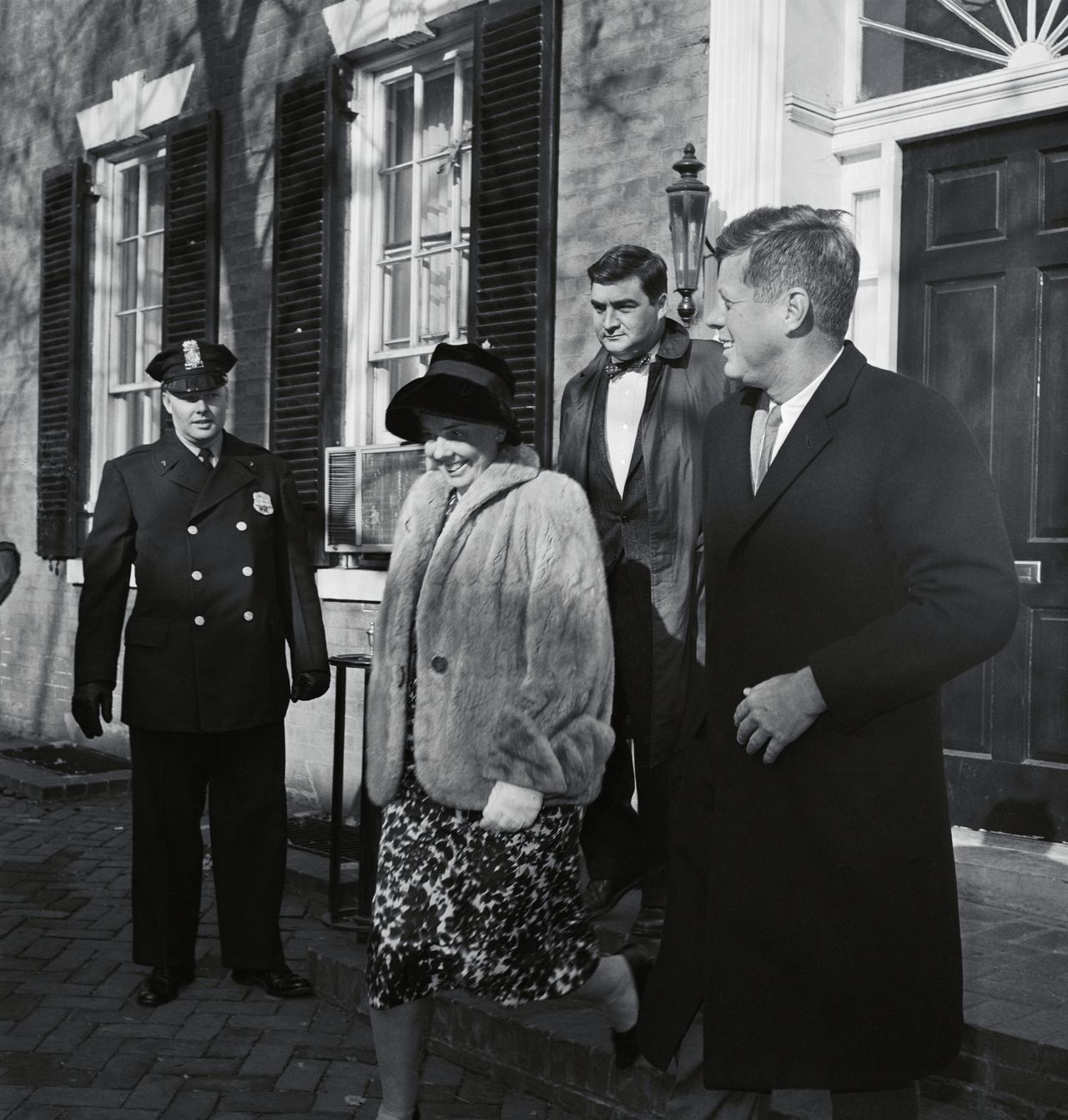 President-elect John F. Kennedy leaves his Georgetown home in November 1960 to see his newborn son, JFK Jr.