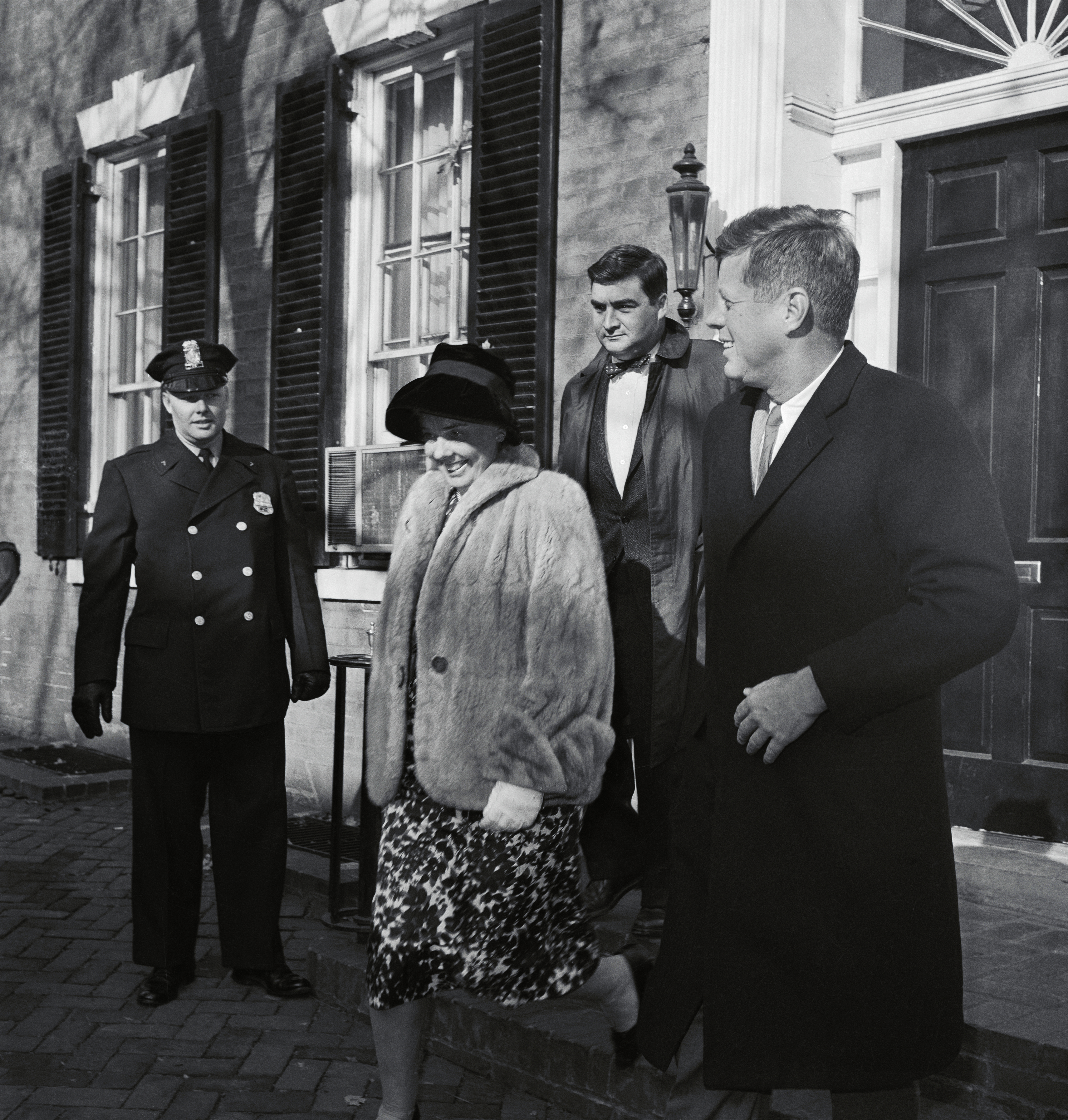 President-elect John F. Kennedy leaves his Georgetown home in November 1960 to see his newborn son, JFK Jr.