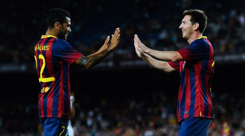 Dani Alves and Lionel Messi celebrate a goal during their time together at Barcelona.