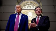 Donald Trump and Mike Johnson speak to members of the media as they depart a House GOP meeting