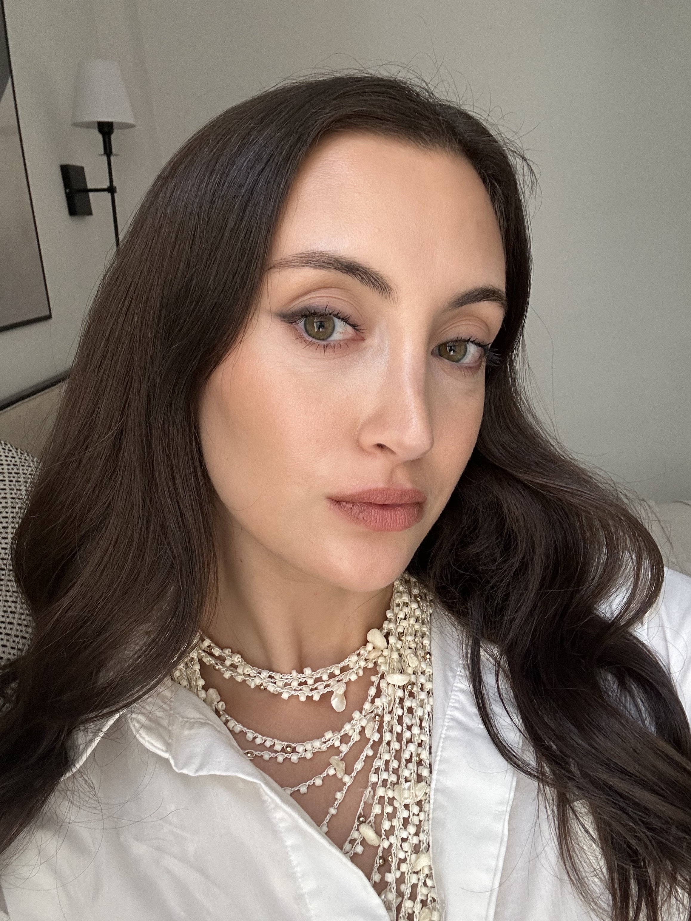 Associate beauty editor Alyssa Brascia wearing the Westman Atelier Lip Suede Matte Lipstick in Piqu&amp;eacute;.