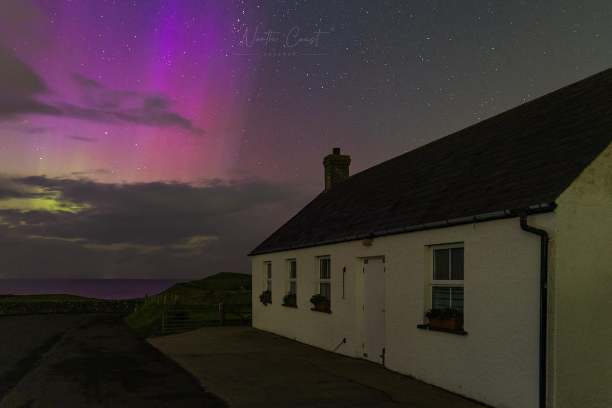 Northern lights above Dunluce Castle, Co Antrim, Northern Ireland captured by photographer North Coast Snapper.