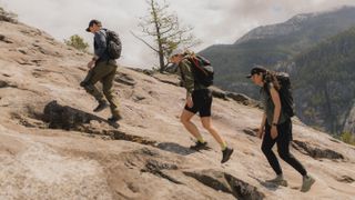 Three hikers testing the Arc'teryx exoskeleton hiking pants