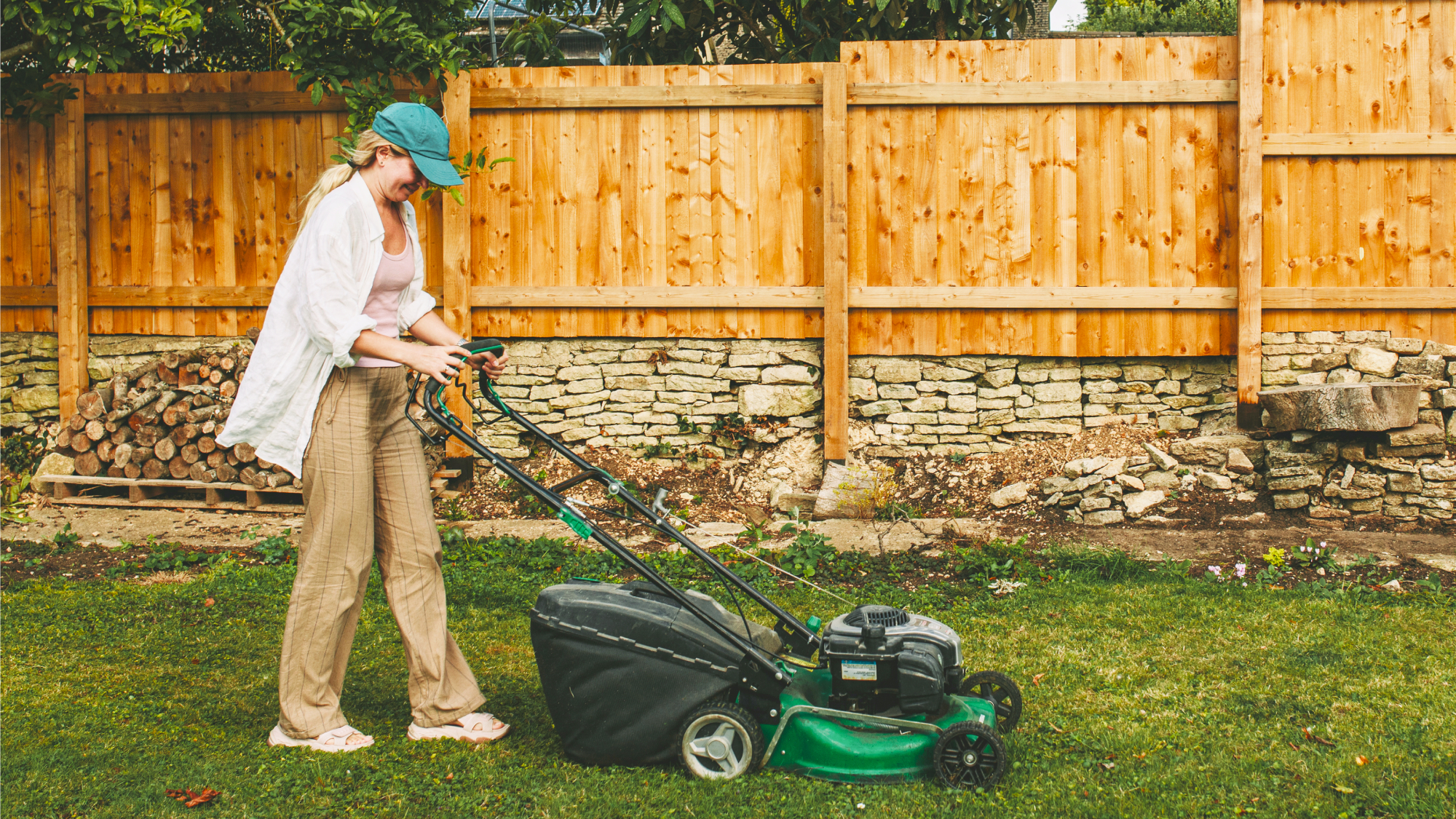 woman mowing the lawn