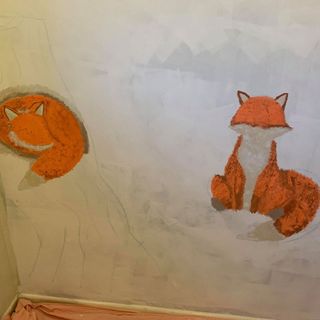 white wall with foxes painted