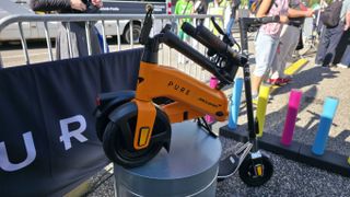 Pure Electric scooters at IFA 2025, it's a sunny day and the stand is forward facing.