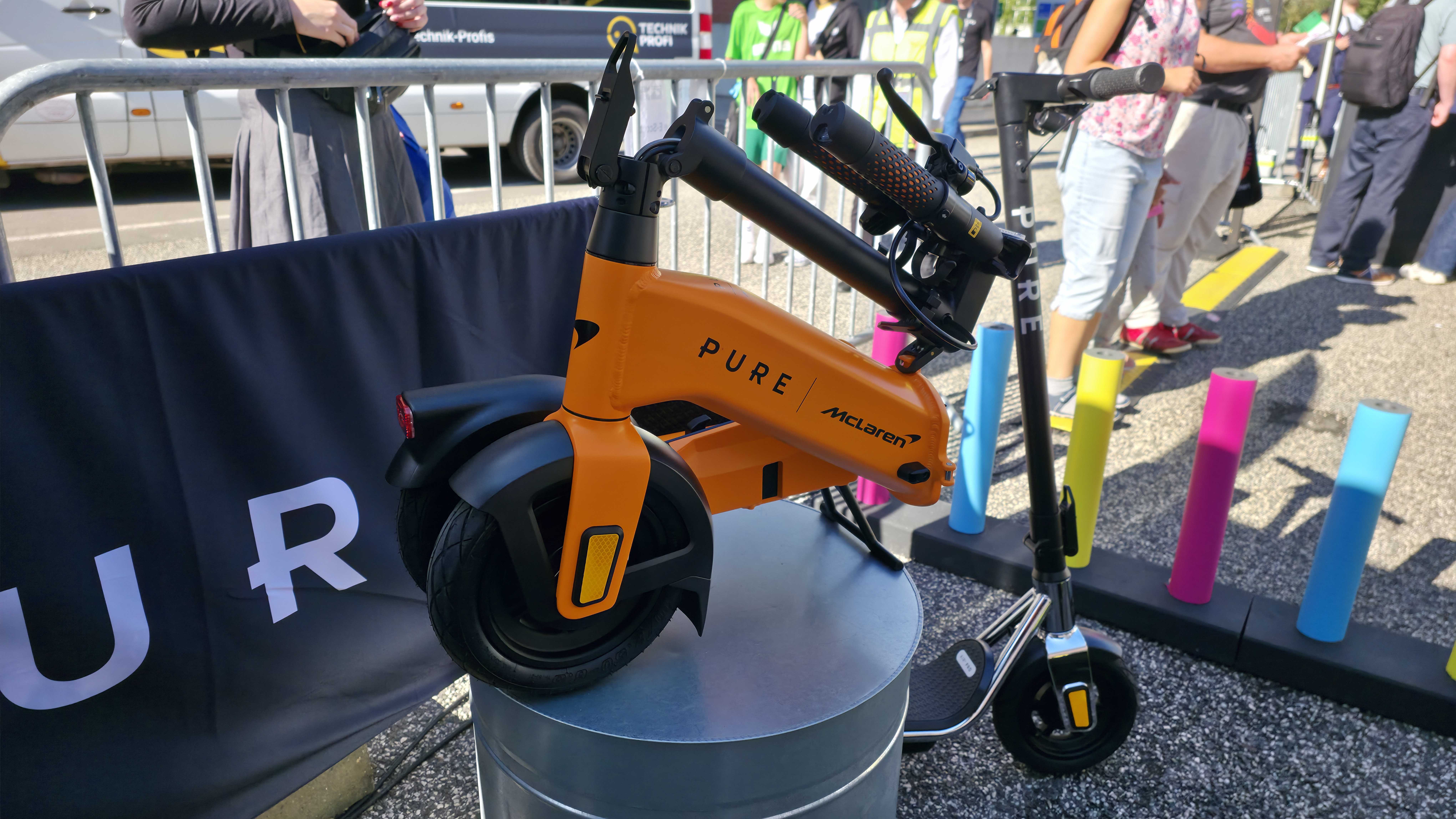 Pure Electric scooters at IFA 2025, it&#039;s a sunny day and the stand is forward facing.