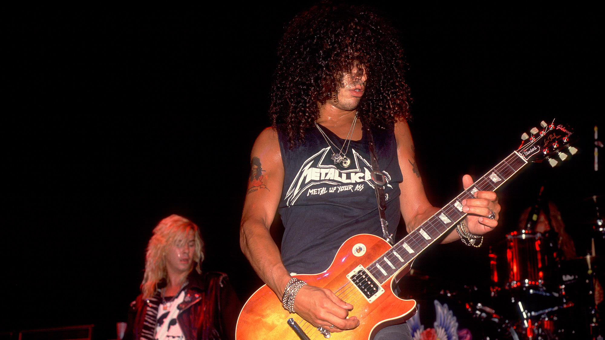 Slash of Guns N' Roses at the Poplar Creek Music Theater in Hoffman Estates, Illinois, July 19, 1988. Duff McKagan is visible in the rear
